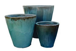 A few tall blue-green cone shaped pots