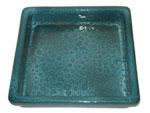 A rectangular blue-green saucer