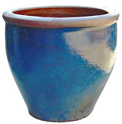 A large blue pot with a rustic rim