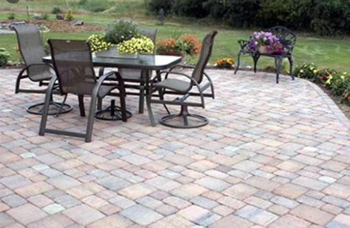 Table and chairs on patio pavers.